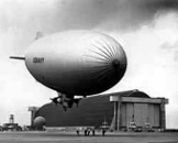 U.S. Navy blimp outside a hangar at Naval Air Station Santa Ana, later MCAS Tustin, in 1943. Archival view of the wartime base.
